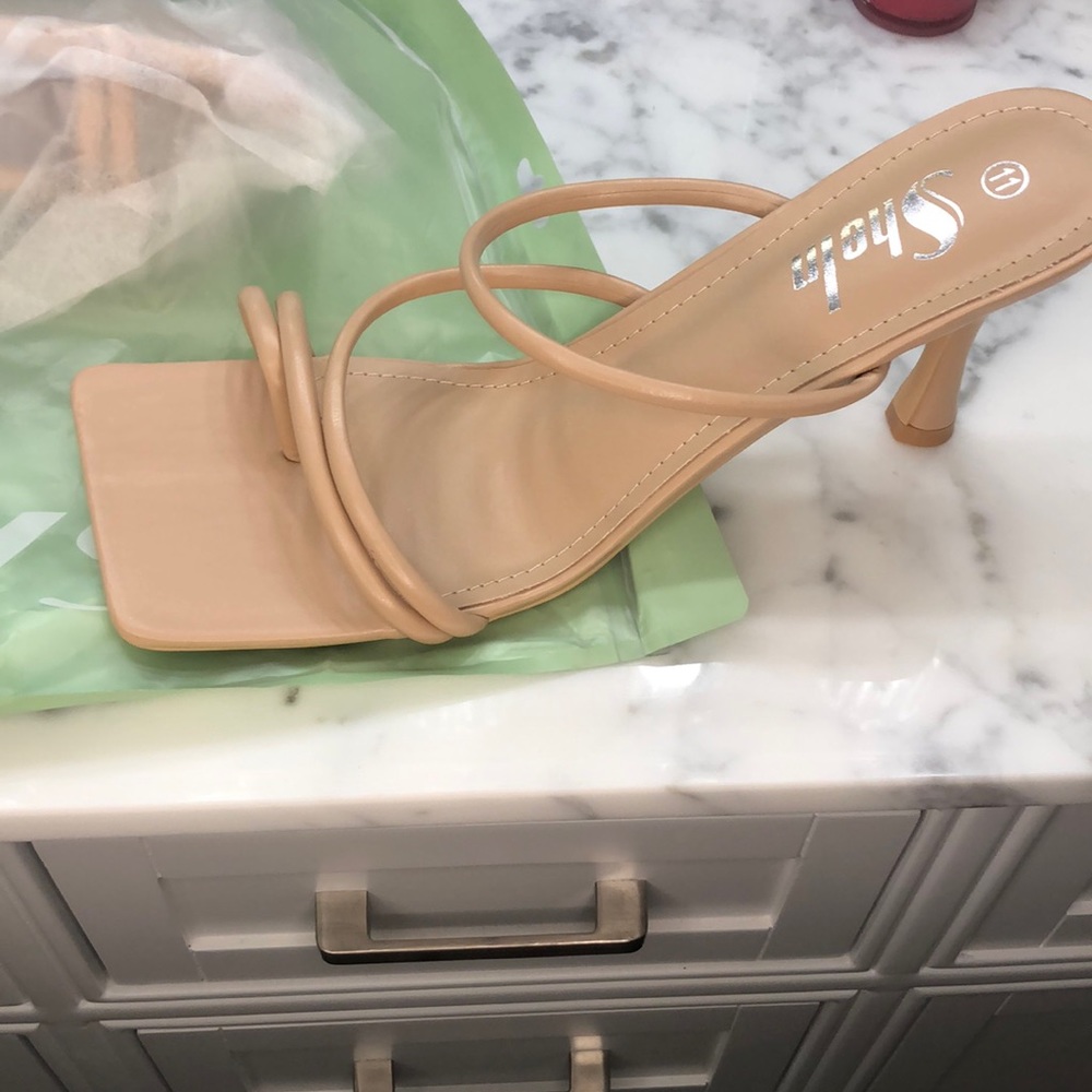 Nude, square toe, strap on heels. Never worn.